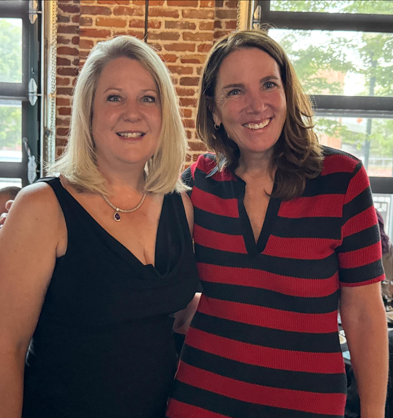 AvenueWest leaders, Angela Healy (left) and Brit Bemis (right) posed together. 