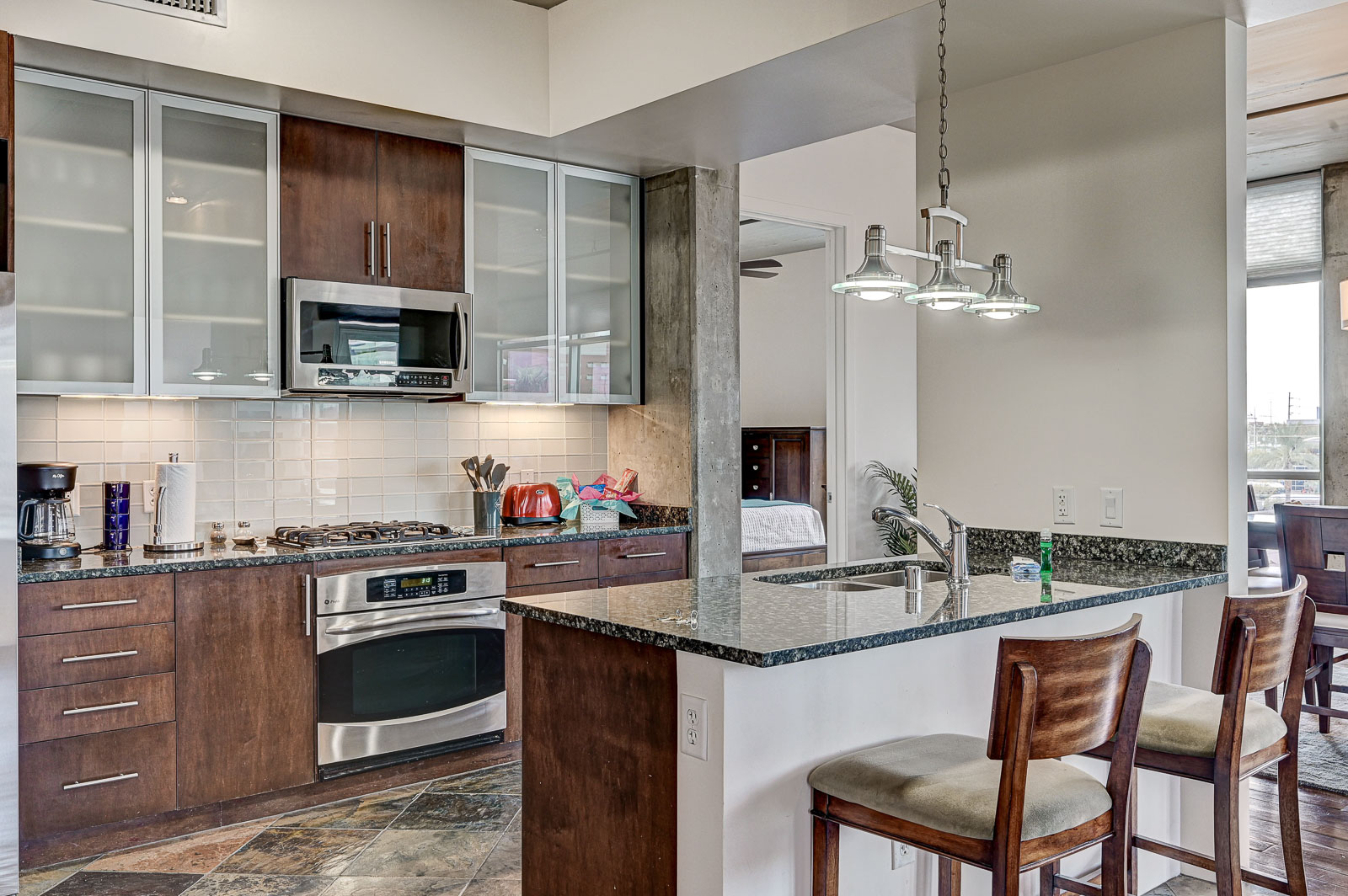 Two-bedroom (possible 3-), two-bath, 4th floor condominium in The Juhl, located in the heart of Las Vegas, NV – the perfect location for any individual traveling for work or play. This spacious two-bedroom condominium not only boasts contemporary living but also extensive amenities to balance your stay.

Juhl is an artfully innovating new condominium in downtown Las Vegas, offering an exceptional collection of distinct residences designed to suit any lifestyle. Rather than conforming to any one model of living, Juhl provides a fresh, open canvas for individual expression. Clean, airy interiors provide limitless flexibility and transition seamlessly to private outdoor terraces. High ceilings and floor-to-ceiling windows maximize height, light and city / Sunset Strip views.

This residence is newly upgraded and professionally furnished. The open kitchen includes granite countertops, stainless steel appliances, custom tile backsplash and is fully equipped with housewares. In the building you can also enjoy cocktails on the Vino Deck (same floor as condo), work out at the gym, and watch a film in the alfresco movie theater. The complex is close to the Art District, Medical District, Smith Center, Las Vegas Academy of Arts and more. Ground-level shops & eateries, short distance to nightlife, public transportation. Parking for 1 vehicle included.
