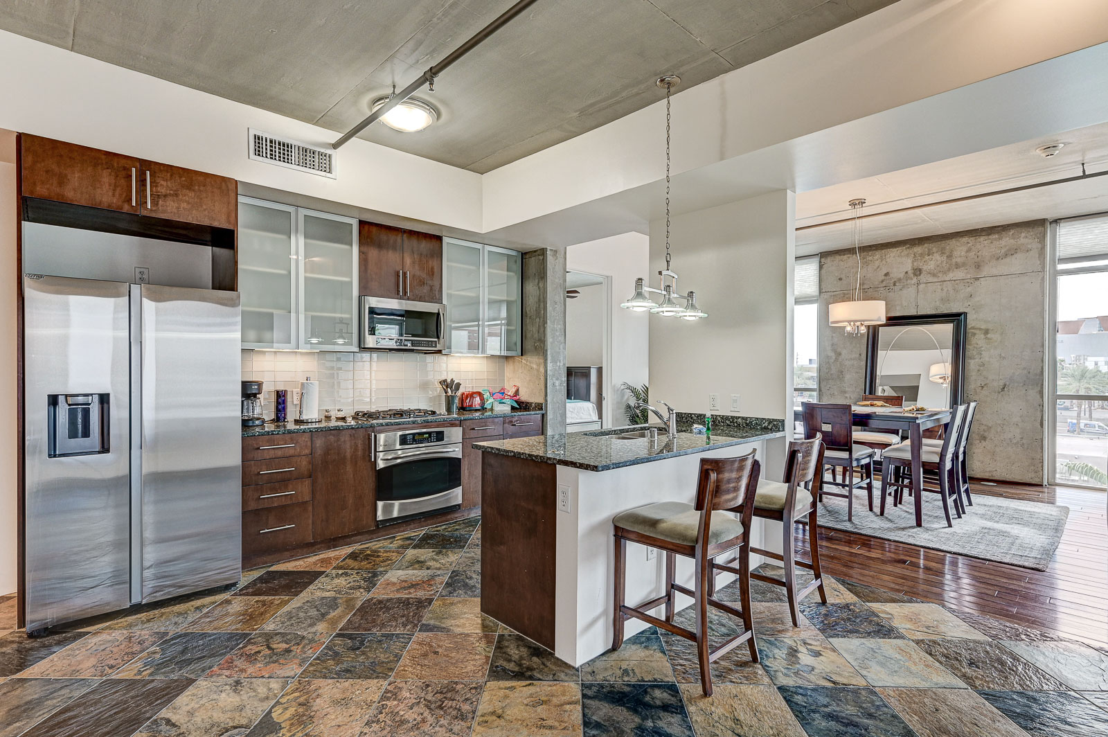 Two-bedroom (possible 3-), two-bath, 4th floor condominium in The Juhl, located in the heart of Las Vegas, NV – the perfect location for any individual traveling for work or play. This spacious two-bedroom condominium not only boasts contemporary living but also extensive amenities to balance your stay.

Juhl is an artfully innovating new condominium in downtown Las Vegas, offering an exceptional collection of distinct residences designed to suit any lifestyle. Rather than conforming to any one model of living, Juhl provides a fresh, open canvas for individual expression. Clean, airy interiors provide limitless flexibility and transition seamlessly to private outdoor terraces. High ceilings and floor-to-ceiling windows maximize height, light and city / Sunset Strip views.

This residence is newly upgraded and professionally furnished. The open kitchen includes granite countertops, stainless steel appliances, custom tile backsplash and is fully equipped with housewares. In the building you can also enjoy cocktails on the Vino Deck (same floor as condo), work out at the gym, and watch a film in the alfresco movie theater. The complex is close to the Art District, Medical District, Smith Center, Las Vegas Academy of Arts and more. Ground-level shops & eateries, short distance to nightlife, public transportation. Parking for 1 vehicle included.
