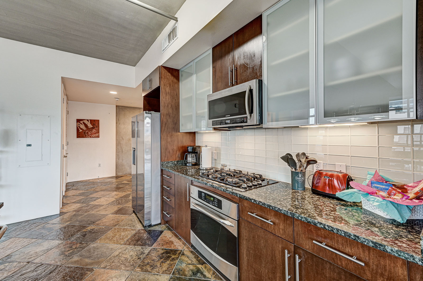 Two-bedroom (possible 3-), two-bath, 4th floor condominium in The Juhl, located in the heart of Las Vegas, NV – the perfect location for any individual traveling for work or play. This spacious two-bedroom condominium not only boasts contemporary living but also extensive amenities to balance your stay.

Juhl is an artfully innovating new condominium in downtown Las Vegas, offering an exceptional collection of distinct residences designed to suit any lifestyle. Rather than conforming to any one model of living, Juhl provides a fresh, open canvas for individual expression. Clean, airy interiors provide limitless flexibility and transition seamlessly to private outdoor terraces. High ceilings and floor-to-ceiling windows maximize height, light and city / Sunset Strip views.

This residence is newly upgraded and professionally furnished. The open kitchen includes granite countertops, stainless steel appliances, custom tile backsplash and is fully equipped with housewares. In the building you can also enjoy cocktails on the Vino Deck (same floor as condo), work out at the gym, and watch a film in the alfresco movie theater. The complex is close to the Art District, Medical District, Smith Center, Las Vegas Academy of Arts and more. Ground-level shops & eateries, short distance to nightlife, public transportation. Parking for 1 vehicle included.
