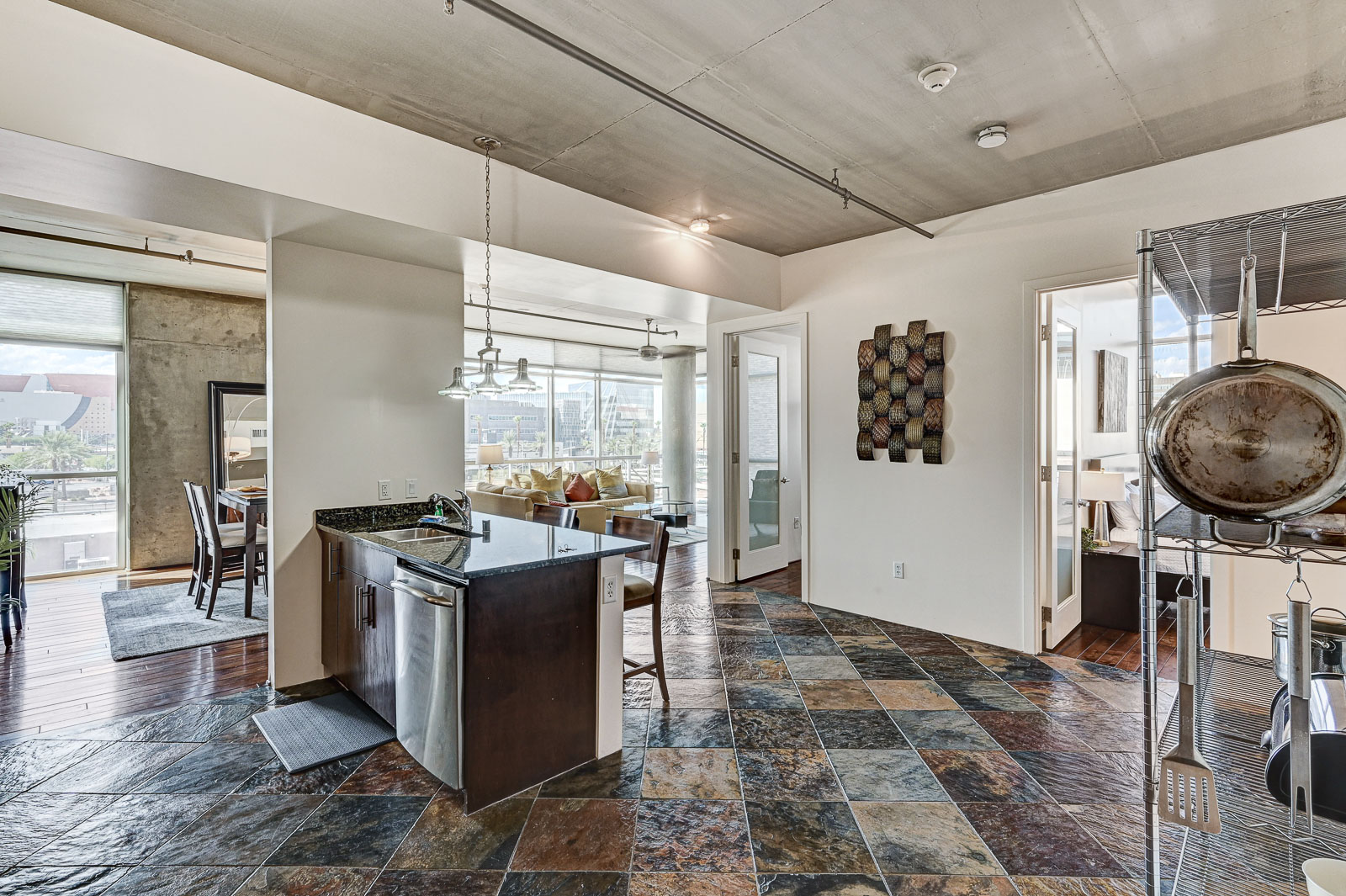 Two-bedroom (possible 3-), two-bath, 4th floor condominium in The Juhl, located in the heart of Las Vegas, NV – the perfect location for any individual traveling for work or play. This spacious two-bedroom condominium not only boasts contemporary living but also extensive amenities to balance your stay.

Juhl is an artfully innovating new condominium in downtown Las Vegas, offering an exceptional collection of distinct residences designed to suit any lifestyle. Rather than conforming to any one model of living, Juhl provides a fresh, open canvas for individual expression. Clean, airy interiors provide limitless flexibility and transition seamlessly to private outdoor terraces. High ceilings and floor-to-ceiling windows maximize height, light and city / Sunset Strip views.

This residence is newly upgraded and professionally furnished. The open kitchen includes granite countertops, stainless steel appliances, custom tile backsplash and is fully equipped with housewares. In the building you can also enjoy cocktails on the Vino Deck (same floor as condo), work out at the gym, and watch a film in the alfresco movie theater. The complex is close to the Art District, Medical District, Smith Center, Las Vegas Academy of Arts and more. Ground-level shops & eateries, short distance to nightlife, public transportation. Parking for 1 vehicle included.
