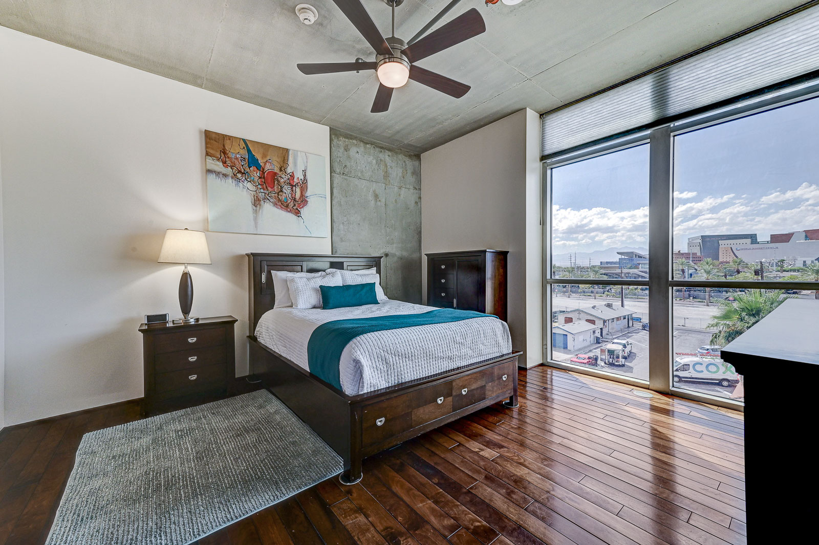 Two-bedroom (possible 3-), two-bath, 4th floor condominium in The Juhl, located in the heart of Las Vegas, NV – the perfect location for any individual traveling for work or play. This spacious two-bedroom condominium not only boasts contemporary living but also extensive amenities to balance your stay.

Juhl is an artfully innovating new condominium in downtown Las Vegas, offering an exceptional collection of distinct residences designed to suit any lifestyle. Rather than conforming to any one model of living, Juhl provides a fresh, open canvas for individual expression. Clean, airy interiors provide limitless flexibility and transition seamlessly to private outdoor terraces. High ceilings and floor-to-ceiling windows maximize height, light and city / Sunset Strip views.

This residence is newly upgraded and professionally furnished. The open kitchen includes granite countertops, stainless steel appliances, custom tile backsplash and is fully equipped with housewares. In the building you can also enjoy cocktails on the Vino Deck (same floor as condo), work out at the gym, and watch a film in the alfresco movie theater. The complex is close to the Art District, Medical District, Smith Center, Las Vegas Academy of Arts and more. Ground-level shops & eateries, short distance to nightlife, public transportation. Parking for 1 vehicle included.
