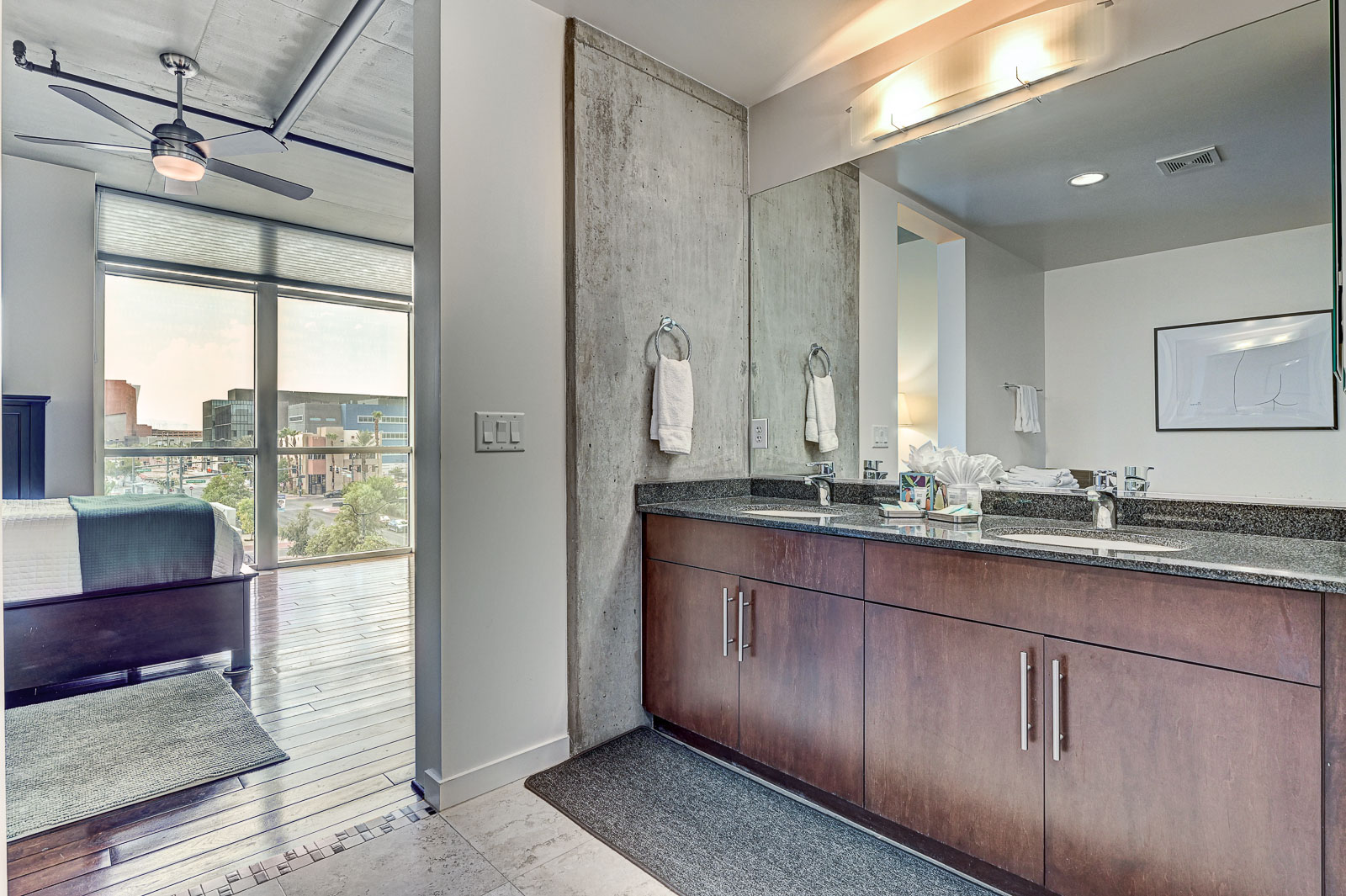 Two-bedroom (possible 3-), two-bath, 4th floor condominium in The Juhl, located in the heart of Las Vegas, NV – the perfect location for any individual traveling for work or play. This spacious two-bedroom condominium not only boasts contemporary living but also extensive amenities to balance your stay.

Juhl is an artfully innovating new condominium in downtown Las Vegas, offering an exceptional collection of distinct residences designed to suit any lifestyle. Rather than conforming to any one model of living, Juhl provides a fresh, open canvas for individual expression. Clean, airy interiors provide limitless flexibility and transition seamlessly to private outdoor terraces. High ceilings and floor-to-ceiling windows maximize height, light and city / Sunset Strip views.

This residence is newly upgraded and professionally furnished. The open kitchen includes granite countertops, stainless steel appliances, custom tile backsplash and is fully equipped with housewares. In the building you can also enjoy cocktails on the Vino Deck (same floor as condo), work out at the gym, and watch a film in the alfresco movie theater. The complex is close to the Art District, Medical District, Smith Center, Las Vegas Academy of Arts and more. Ground-level shops & eateries, short distance to nightlife, public transportation. Parking for 1 vehicle included.
