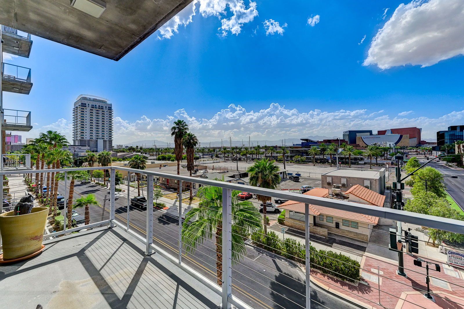 Two-bedroom (possible 3-), two-bath, 4th floor condominium in The Juhl, located in the heart of Las Vegas, NV – the perfect location for any individual traveling for work or play. This spacious two-bedroom condominium not only boasts contemporary living but also extensive amenities to balance your stay.

Juhl is an artfully innovating new condominium in downtown Las Vegas, offering an exceptional collection of distinct residences designed to suit any lifestyle. Rather than conforming to any one model of living, Juhl provides a fresh, open canvas for individual expression. Clean, airy interiors provide limitless flexibility and transition seamlessly to private outdoor terraces. High ceilings and floor-to-ceiling windows maximize height, light and city / Sunset Strip views.

This residence is newly upgraded and professionally furnished. The open kitchen includes granite countertops, stainless steel appliances, custom tile backsplash and is fully equipped with housewares. In the building you can also enjoy cocktails on the Vino Deck (same floor as condo), work out at the gym, and watch a film in the alfresco movie theater. The complex is close to the Art District, Medical District, Smith Center, Las Vegas Academy of Arts and more. Ground-level shops & eateries, short distance to nightlife, public transportation. Parking for 1 vehicle included.
