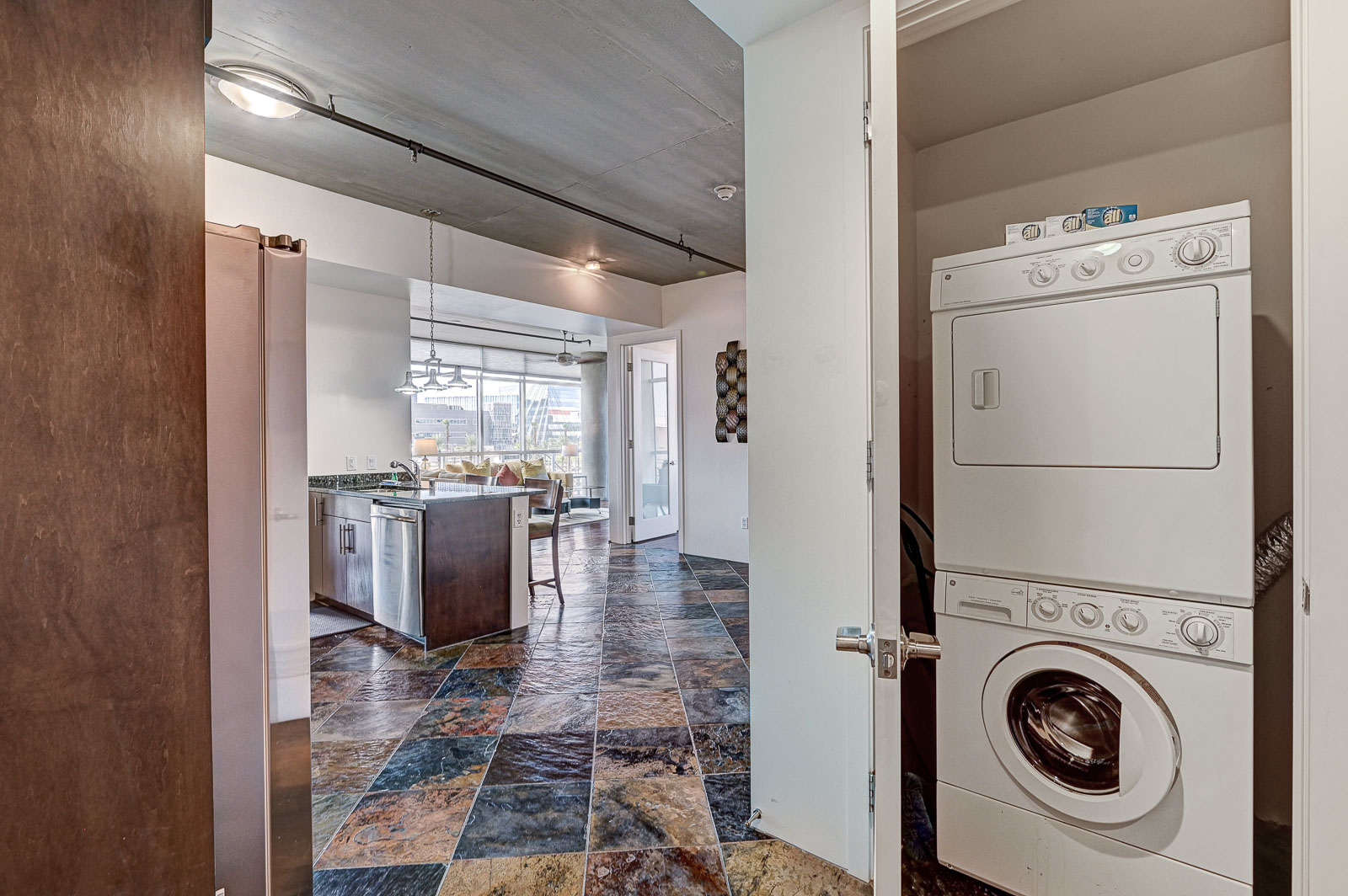Two-bedroom (possible 3-), two-bath, 4th floor condominium in The Juhl, located in the heart of Las Vegas, NV – the perfect location for any individual traveling for work or play. This spacious two-bedroom condominium not only boasts contemporary living but also extensive amenities to balance your stay.

Juhl is an artfully innovating new condominium in downtown Las Vegas, offering an exceptional collection of distinct residences designed to suit any lifestyle. Rather than conforming to any one model of living, Juhl provides a fresh, open canvas for individual expression. Clean, airy interiors provide limitless flexibility and transition seamlessly to private outdoor terraces. High ceilings and floor-to-ceiling windows maximize height, light and city / Sunset Strip views.

This residence is newly upgraded and professionally furnished. The open kitchen includes granite countertops, stainless steel appliances, custom tile backsplash and is fully equipped with housewares. In the building you can also enjoy cocktails on the Vino Deck (same floor as condo), work out at the gym, and watch a film in the alfresco movie theater. The complex is close to the Art District, Medical District, Smith Center, Las Vegas Academy of Arts and more. Ground-level shops & eateries, short distance to nightlife, public transportation. Parking for 1 vehicle included.
