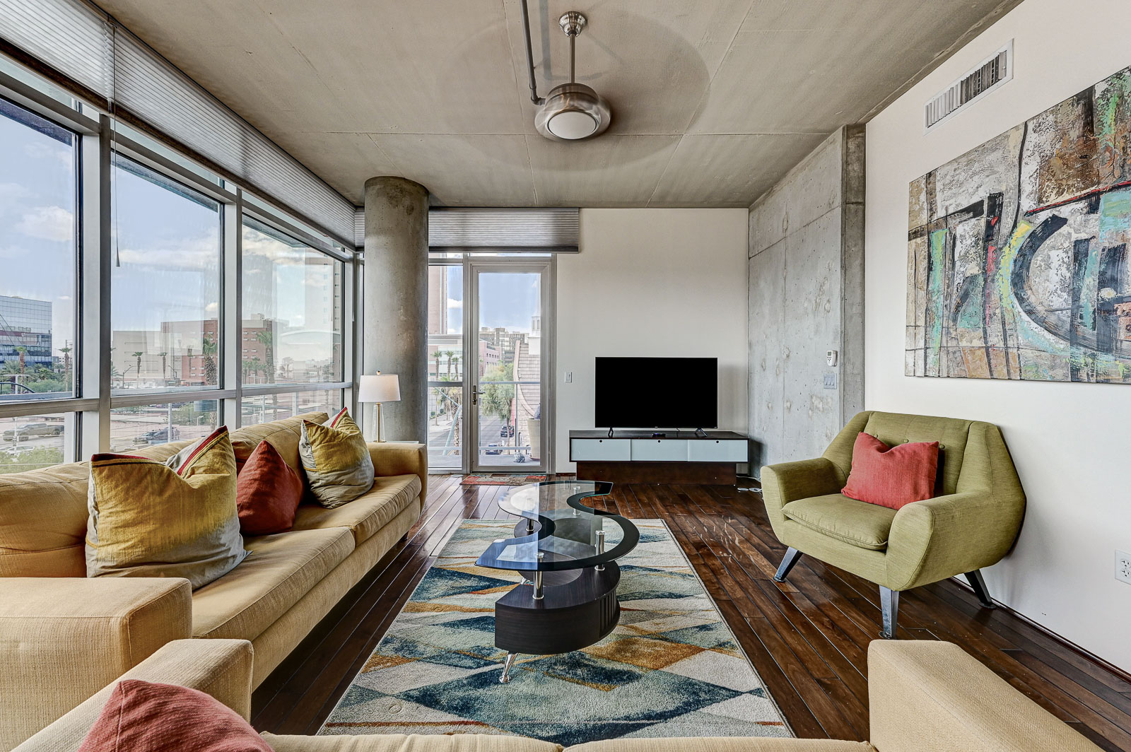 Two-bedroom (possible 3-), two-bath, 4th floor condominium in The Juhl, located in the heart of Las Vegas, NV – the perfect location for any individual traveling for work or play. This spacious two-bedroom condominium not only boasts contemporary living but also extensive amenities to balance your stay.

Juhl is an artfully innovating new condominium in downtown Las Vegas, offering an exceptional collection of distinct residences designed to suit any lifestyle. Rather than conforming to any one model of living, Juhl provides a fresh, open canvas for individual expression. Clean, airy interiors provide limitless flexibility and transition seamlessly to private outdoor terraces. High ceilings and floor-to-ceiling windows maximize height, light and city / Sunset Strip views.

This residence is newly upgraded and professionally furnished. The open kitchen includes granite countertops, stainless steel appliances, custom tile backsplash and is fully equipped with housewares. In the building you can also enjoy cocktails on the Vino Deck (same floor as condo), work out at the gym, and watch a film in the alfresco movie theater. The complex is close to the Art District, Medical District, Smith Center, Las Vegas Academy of Arts and more. Ground-level shops & eateries, short distance to nightlife, public transportation. Parking for 1 vehicle included.
