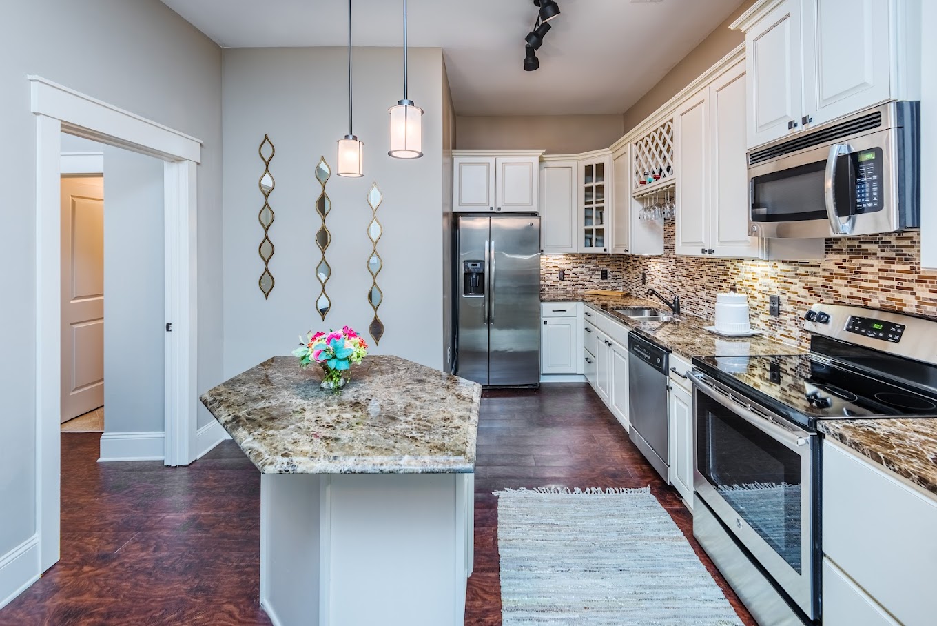 Luxury Plank Flooring, Marble Countertops, Large Islands, Custom Cabinetry, Oil Rubbed Bronze Finishes, Stainless Steel Appliances, Kitchen Pantries