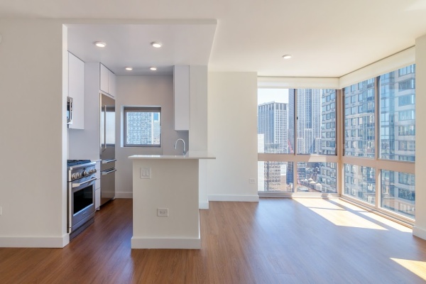 Floor to ceiling windows, large square foot, river and city views, hard surface flooring 