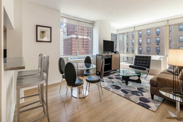 Floor to ceiling windows, large square footage, river and city views, hard surface flooring 