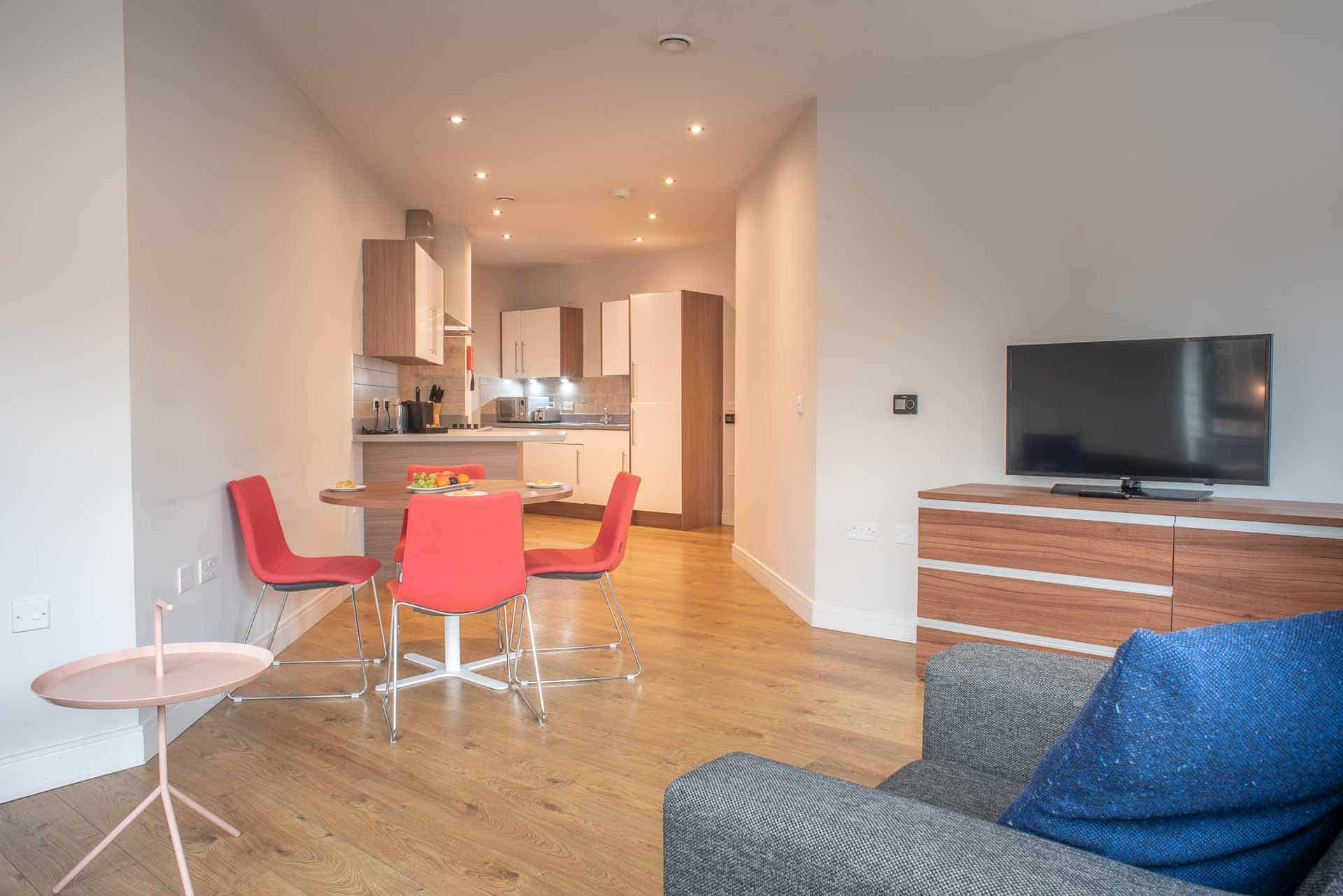 img Open plan lounge and kitchen at PREMIER SUITES PLUS Glasgow Bath Street AvenueWest Global