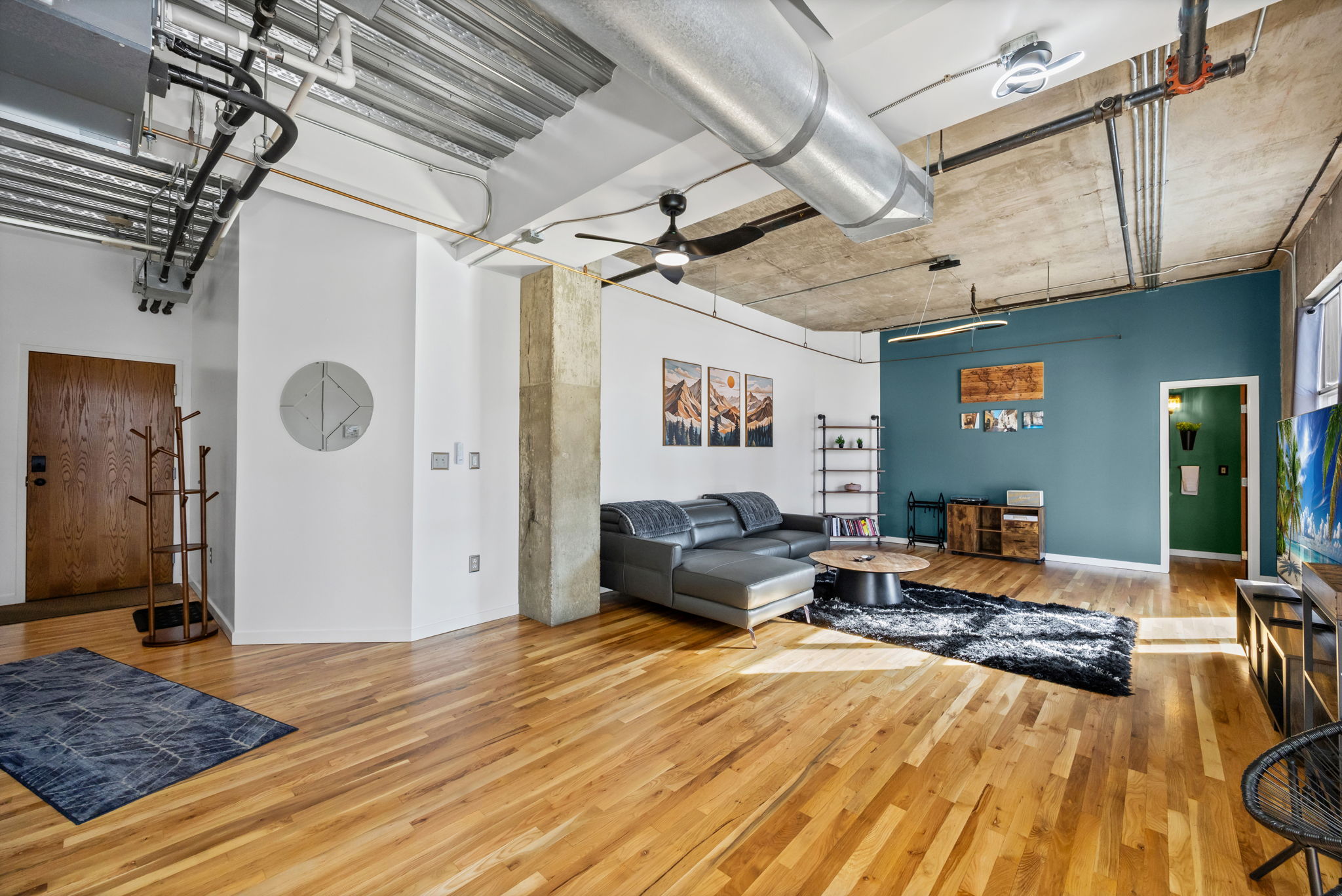 This fully furnished 1 bedroom, 1.5 bathroom condo is located in the sought-after Arapahoe SkyLofts, right in the heart of Denver. Offering 1,124 square feet of thoughtfully designed living space, this home blends modern loft-style character with comfort and convenience.
 
The condo features hardwood floors, concrete walls, and exposed ductwork, creating a clean, contemporary industrial aesthetic. The open living area flows seamlessly into the dining space, which includes seating for four, plus two bar stools at the kitchen counter, making it ideal for entertaining or casual meals.
 
The spacious primary bedroom is furnished with a king bed and provides a quiet retreat. The primary bathroom includes a tub/shower combination, while a convenient half-bath powder room is located off the main living area—perfect for guests. An in-unit washer and dryer adds everyday convenience.
 
Step out onto the private balcony and enjoy views of downtown Denver, a perfect spot for morning coffee or evening relaxation.
 
Parking is a rare downtown luxury, and this unit includes two parking spaces in the attached garage—one suitable for a compact vehicle and the other for a full-size car.
 
Built in 1983, Arapahoe SkyLofts is ideally situated near Union Station and Coors Field, with easy access to downtown office buildings, public transportation, and major roadways. The neighborhood offers an abundance of restaurants, coffee shops, and retail options, all within close proximity.
 
This fully furnished condo provides an exceptional opportunity to enjoy urban living with space, style, and convenience in one of Denver’s most vibrant locations.