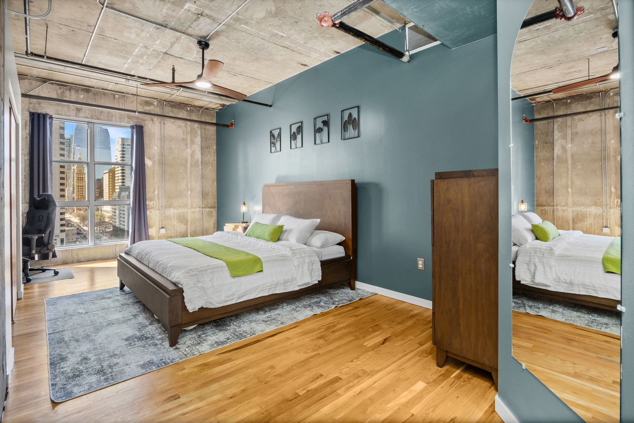 This fully furnished 1 bedroom, 1.5 bathroom condo is located in the sought-after Arapahoe SkyLofts, right in the heart of Denver. Offering 1,124 square feet of thoughtfully designed living space, this home blends modern loft-style character with comfort and convenience.
 
The condo features hardwood floors, concrete walls, and exposed ductwork, creating a clean, contemporary industrial aesthetic. The open living area flows seamlessly into the dining space, which includes seating for four, plus two bar stools at the kitchen counter, making it ideal for entertaining or casual meals.
 
The spacious primary bedroom is furnished with a king bed and provides a quiet retreat. The primary bathroom includes a tub/shower combination, while a convenient half-bath powder room is located off the main living area—perfect for guests. An in-unit washer and dryer adds everyday convenience.
 
Step out onto the private balcony and enjoy views of downtown Denver, a perfect spot for morning coffee or evening relaxation.
 
Parking is a rare downtown luxury, and this unit includes two parking spaces in the attached garage—one suitable for a compact vehicle and the other for a full-size car.
 
Built in 1983, Arapahoe SkyLofts is ideally situated near Union Station and Coors Field, with easy access to downtown office buildings, public transportation, and major roadways. The neighborhood offers an abundance of restaurants, coffee shops, and retail options, all within close proximity.
 
This fully furnished condo provides an exceptional opportunity to enjoy urban living with space, style, and convenience in one of Denver’s most vibrant locations.